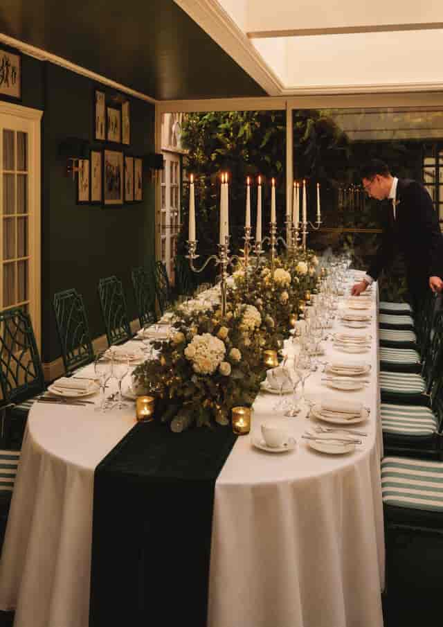 Luxury Christmas party table setting with elegant candelabras at The Chesterfield Mayfair.