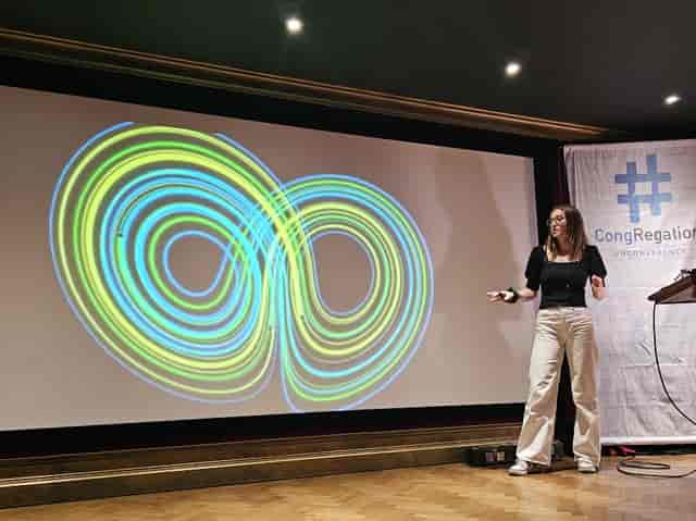 Speaker presenting with projection at Chequer Mead Theatre for CongRegation conference.
