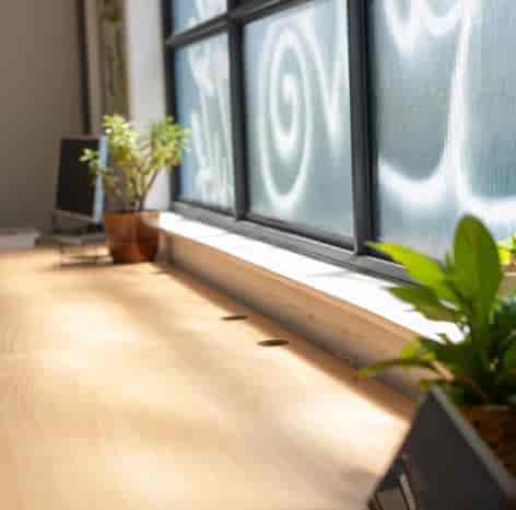 Modern content creation studio with integrated desk power for collaborative workspace events.