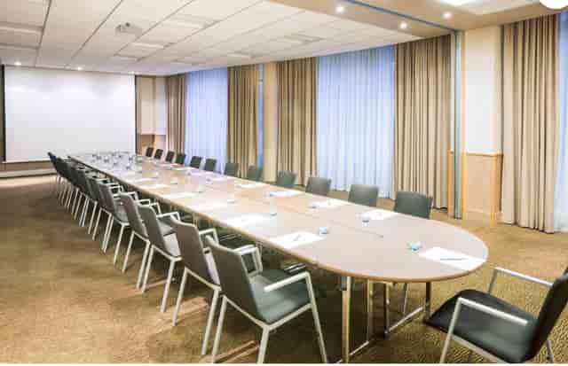 Boardroom setup at Novotel Reading Centre with AV screen for corporate meetings and conferences.