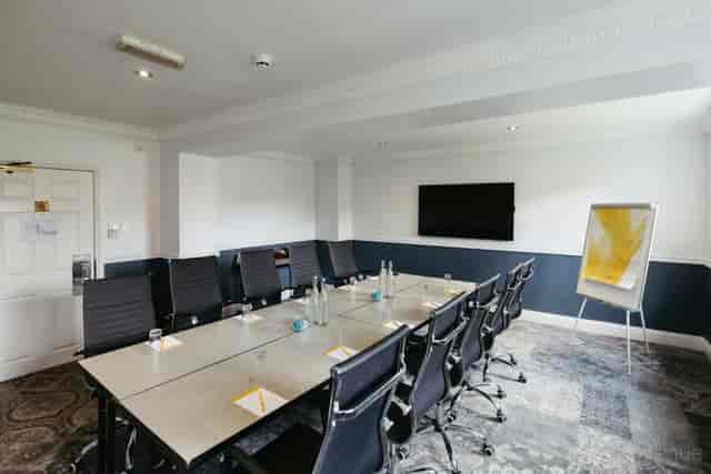 Boardroom-style Main Meeting Room for corporate events and professional business workshops.