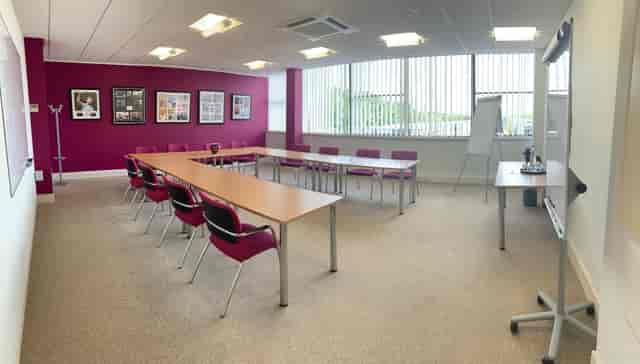U-shaped meeting room in Solihull Hospital for corporate training and board-level events.