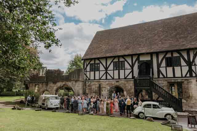 Outdoor cocktail hour at The Old Bank York with vintage car display for events.