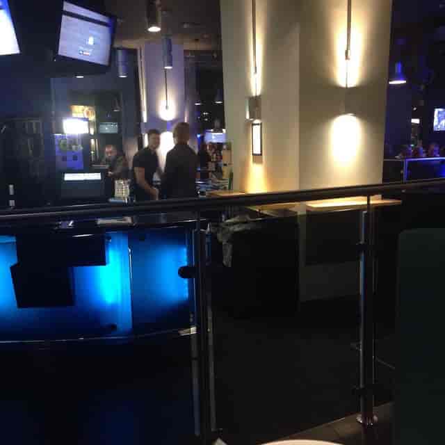 Contemporary semi-private lounge with integrated AV for networking receptions and corporate events.