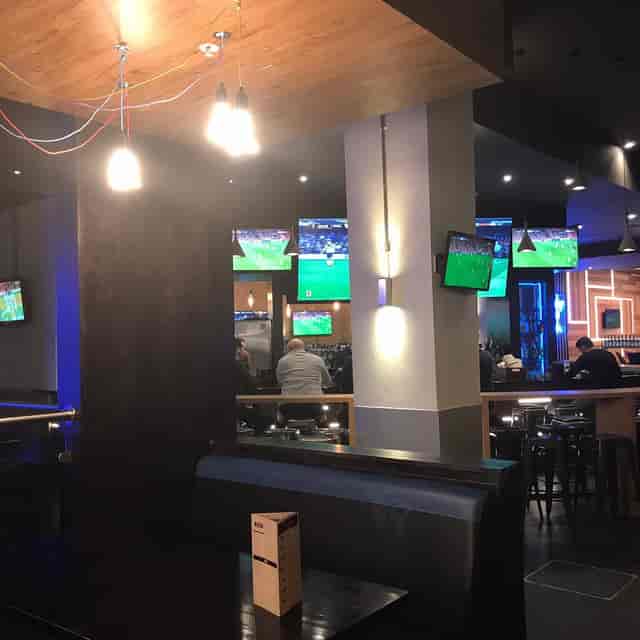 Semi-private Shark Club area with high-energy decor for networking and incentive events.