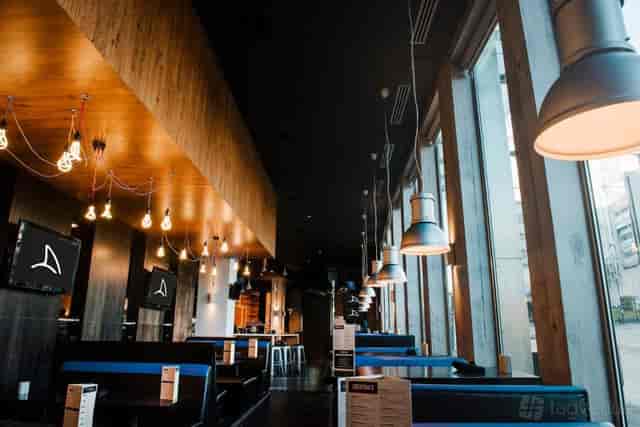 Semi-private booth seating at Shark Club Gastro Bar for corporate networking and happy hour events.