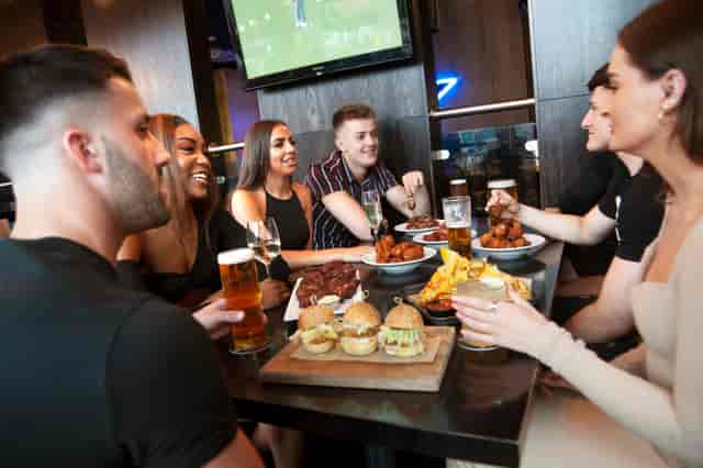 VIP area at Shark Club Gastro Bar with shared plates for group events and social dining.