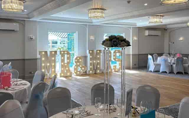 Four Ashes wedding reception at Regency Hotel Solihull featuring modern transparent centerpieces.