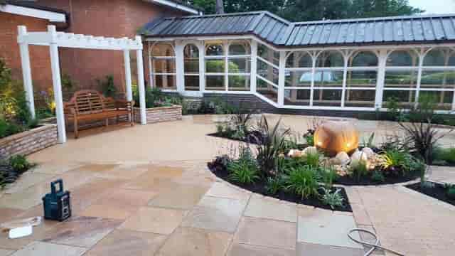 Outdoor cocktail reception area at The Crown Solihull with pergola lighting for event networking.