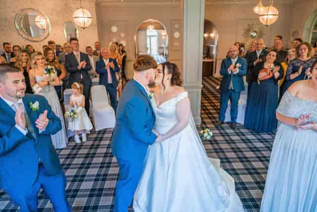Wedding ceremony at Regency Hotel Solihull ballroom with aisle and theater seating.
