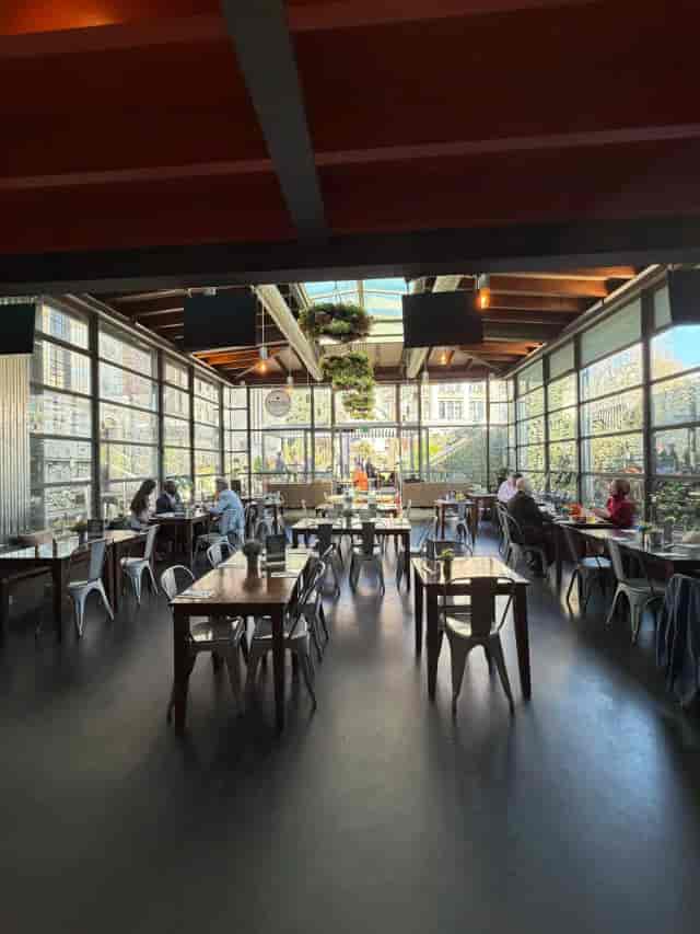Glass-enclosed atrium venue in Byward Kitchen and Bar for corporate networking and social events.