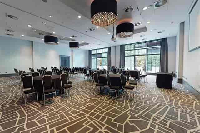 Modern meeting space with banquet seating for corporate events and social functions in Solihull.