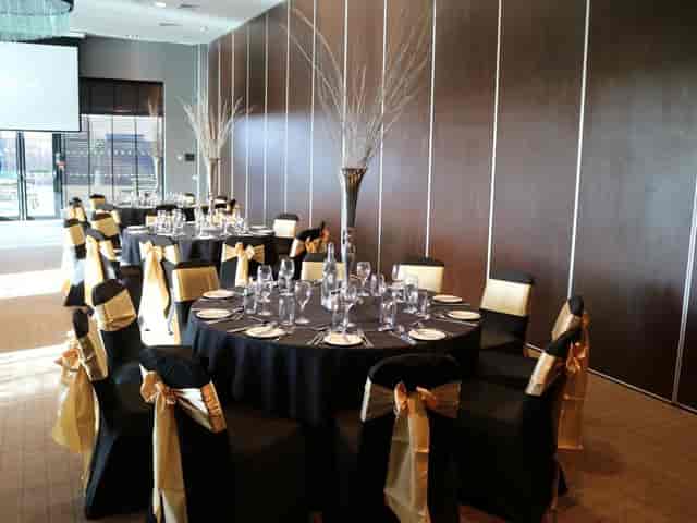 Gala banquet setup in VWorks Solihull with gold accents, perfect for corporate events and weddings.