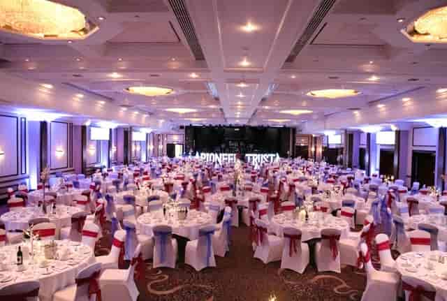 VWorks Solihull ballroom set for corporate gala dinner with stage and banquet seating.