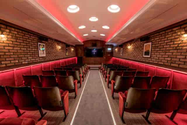 Industrial screening room at The Grubstreet Cellars with brick walls for private events.