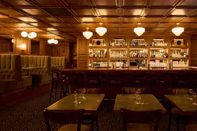 Vodka Studio lounge with wood accents for premium corporate networking and cocktail events.