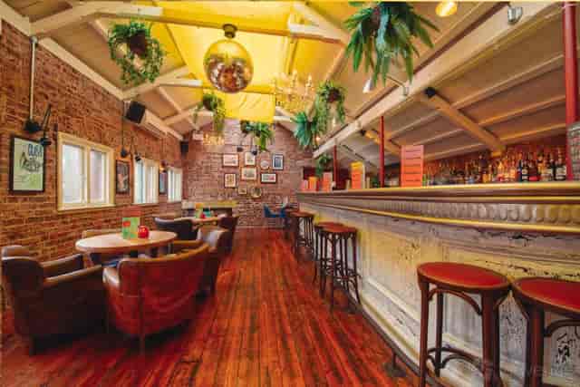 Industrial-chic Main Bar at Revolution America Square for corporate receptions and mixers.