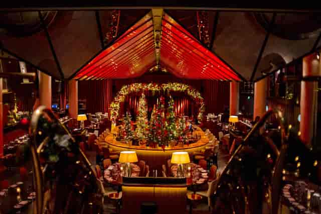 Be At One Monument ground floor bar, festive gala event space, luxury corporate dinner venue.