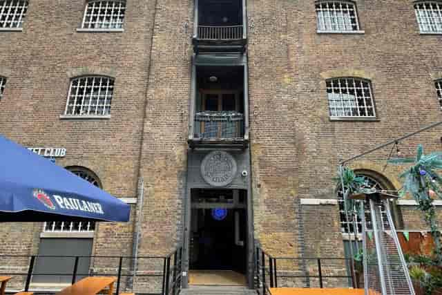 The Arch at Munich Cricket Club: Exposed brick industrial venue for outdoor mixers and activations.