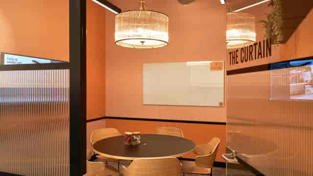 Modern meeting room with whiteboard for collaborative workshops and office breakout sessions.