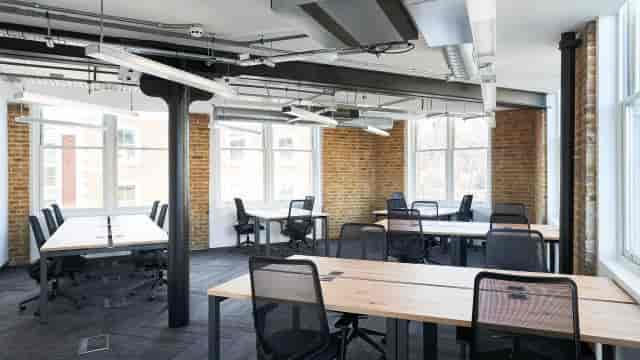 Modern industrial-chic co-working space for team-building workshops and collaborative meetings.