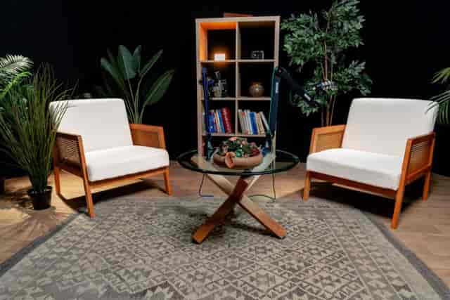 Podcast studio with boom microphones for professional recording sessions and content production.