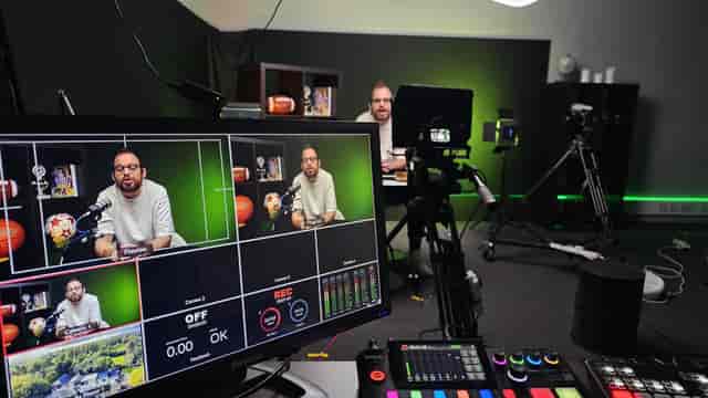 Professional podcast studio with green screen for live-streamed keynote event production.