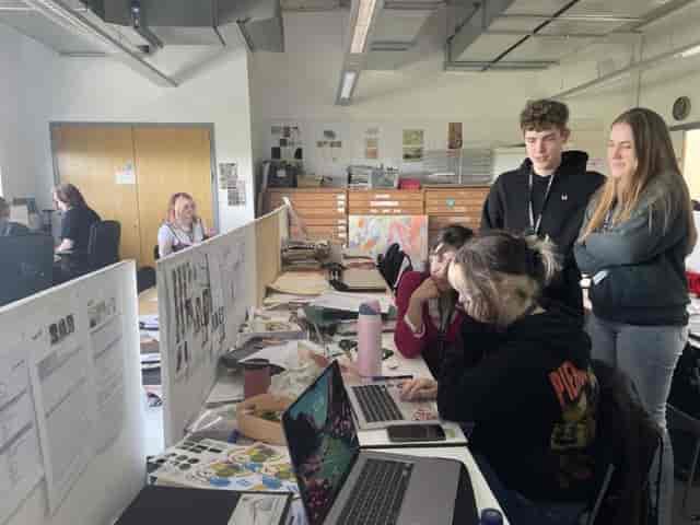 Cramped office brainstorming session, poor room layout for team collaboration and event space.