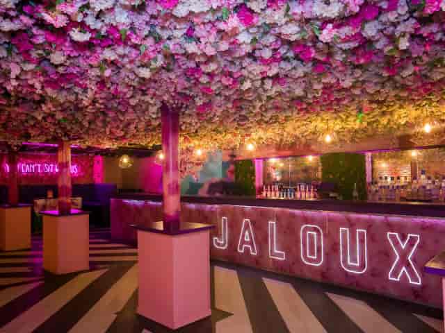 Jaloux floral ceiling venue: high-energy nightlife and brand activation space.