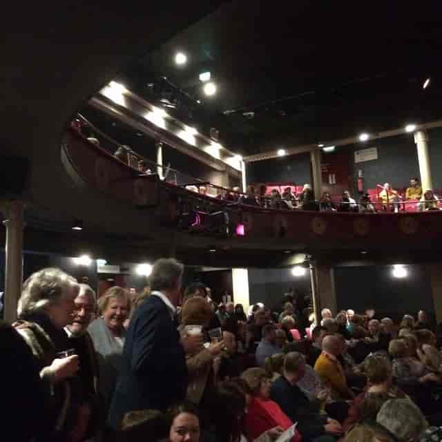 Audenshaw School theater with beverage service for pre-show networking and corporate events.