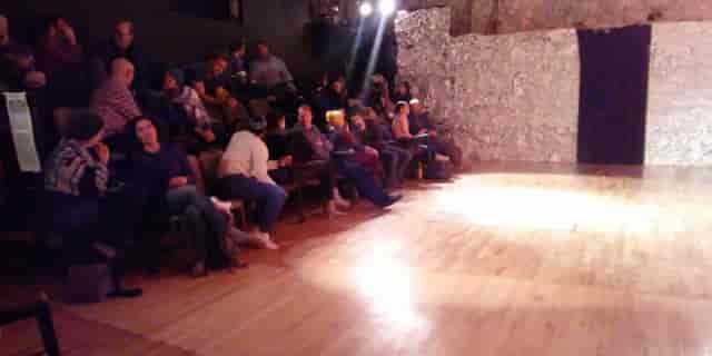 Intimate black-box stage at Bristol Improv Theatre for grassroots performance and comedy events.