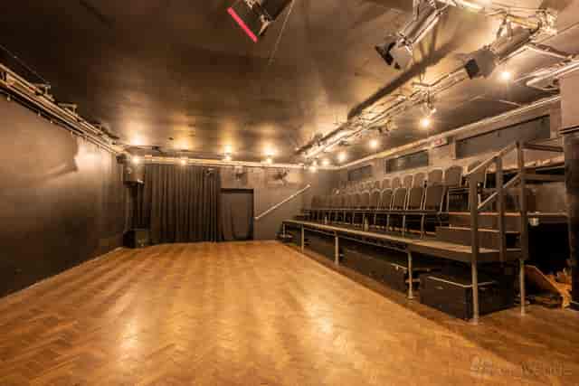 Bristol Improv Theatre black-box studio with tiered seating for workshops and performing arts events.