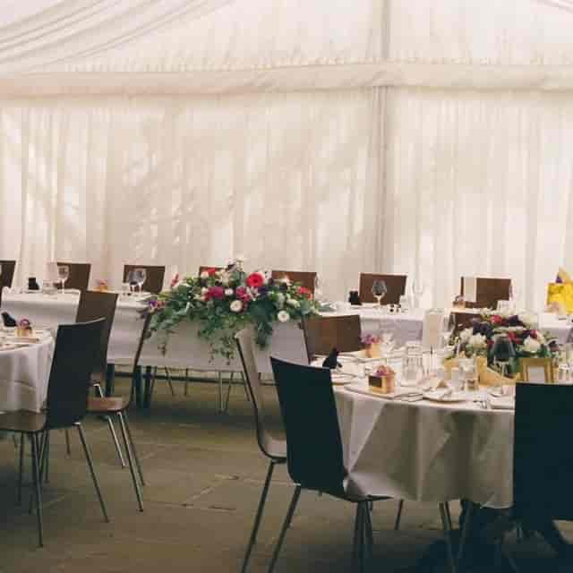 Elegant marquee event space at Tree House Croydon with floral decor for formal weddings.