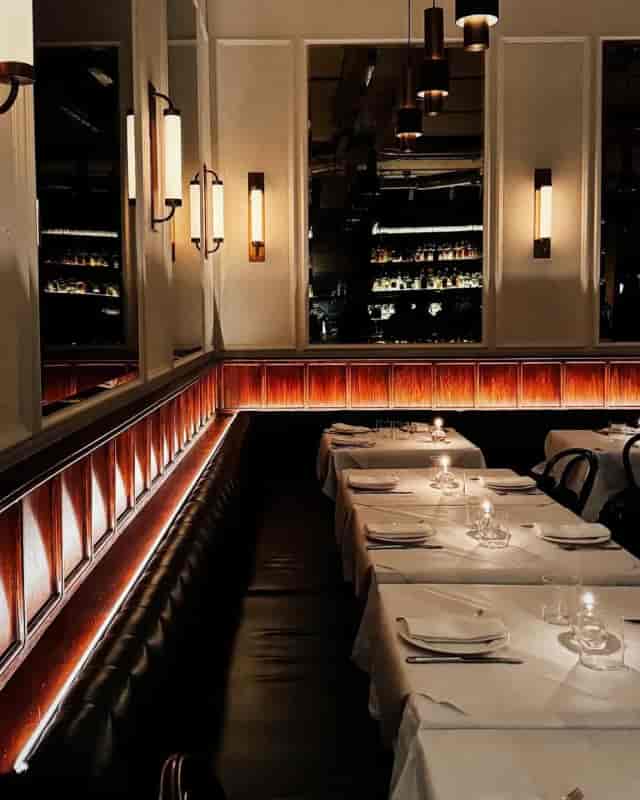 Intimate Morchella restaurant for corporate dinners and networking events with white-tablecloths.