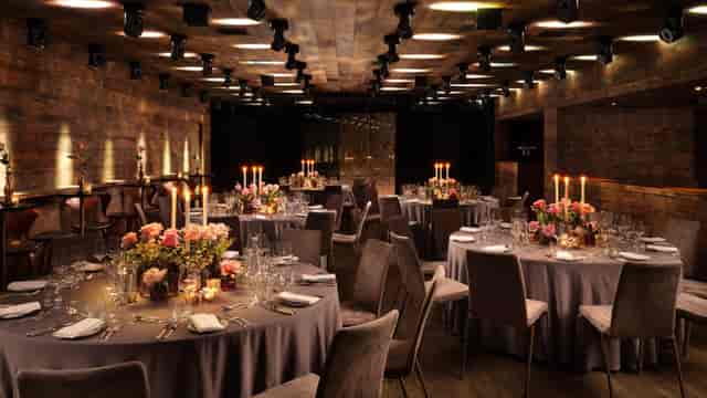 Soho Square venue with rustic wood panels for a luxury gala dinner or corporate reception.