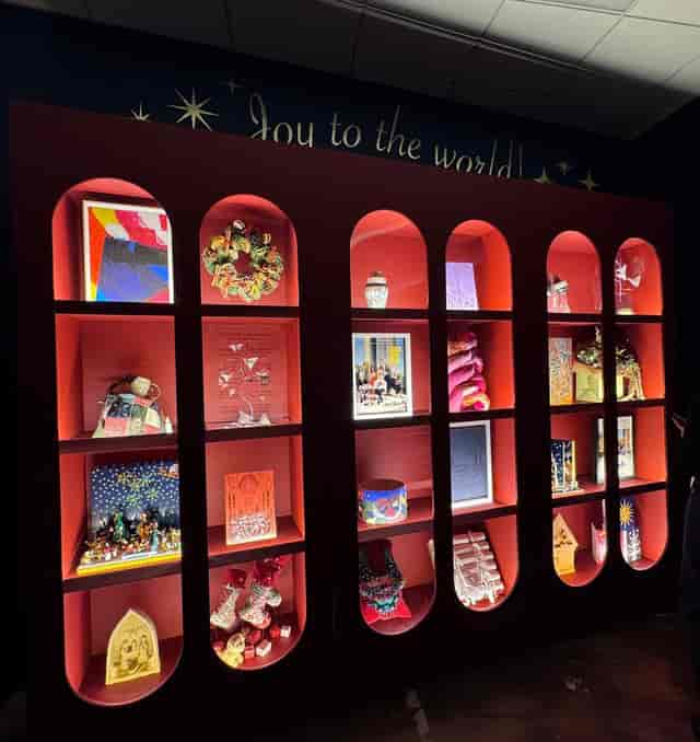 Branded arched shelving in aesthetic creative space for corporate event or gala venue.