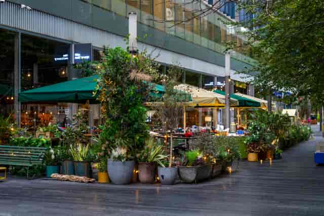 Outdoor networking space at Southwick with bistro lighting for corporate events and receptions.