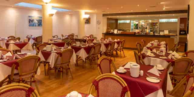 Southwick dining room event venue with square tables for catered breakfast and corporate events.
