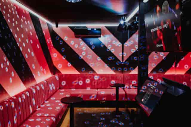 Private karaoke suite at PLAYBOX Croydon, high-energy event space for team building.