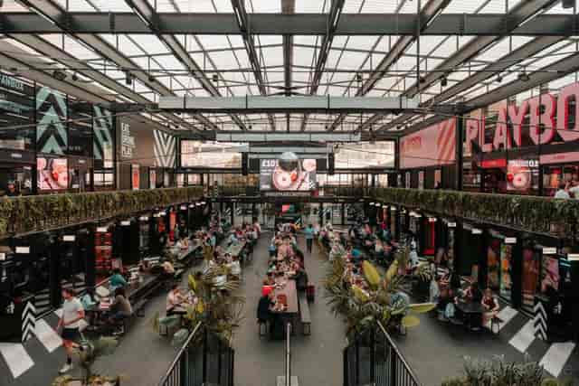 PLAYBOX Croydon industrial event venue with long-table seating for networking and brand activations.