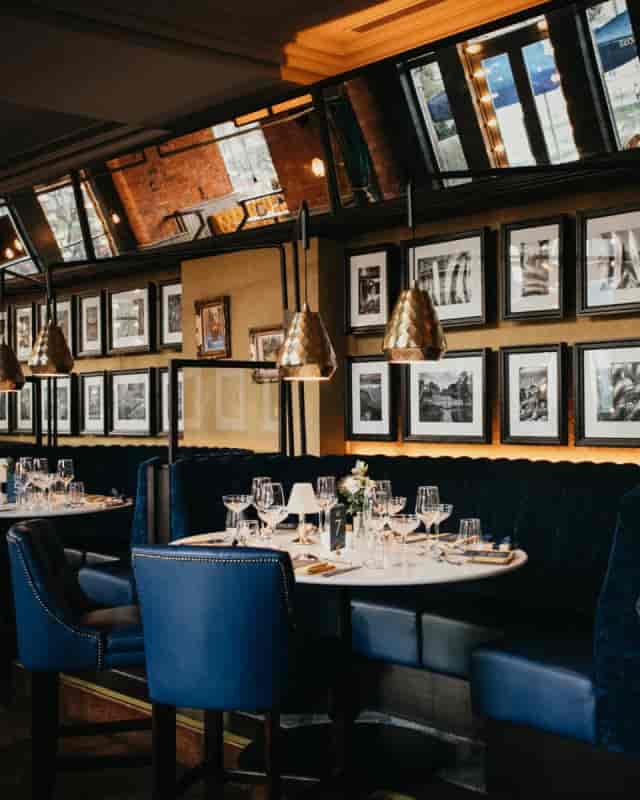 Elegant navy dining booth at Mezzanine in Fern for corporate dinners and VIP events.