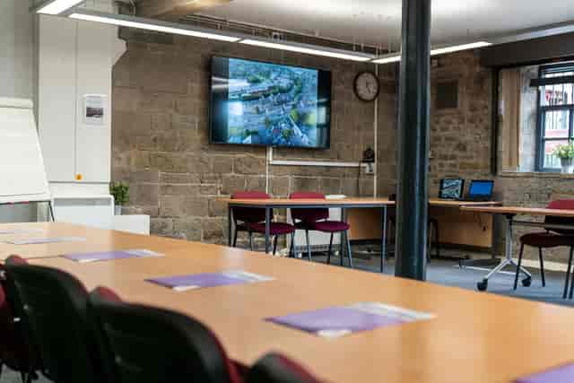 Industrial-chic boardroom at Mezzanine in Fern for corporate workshops and meetings.