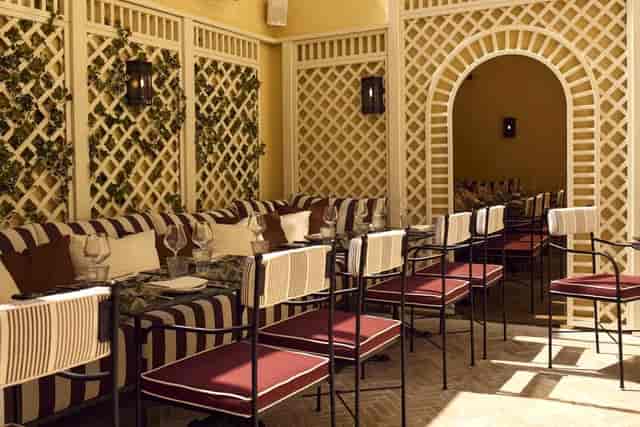 Mezzanine at Fern: Sophisticated trellis-backed dining alcove for VIP luncheons and networking.