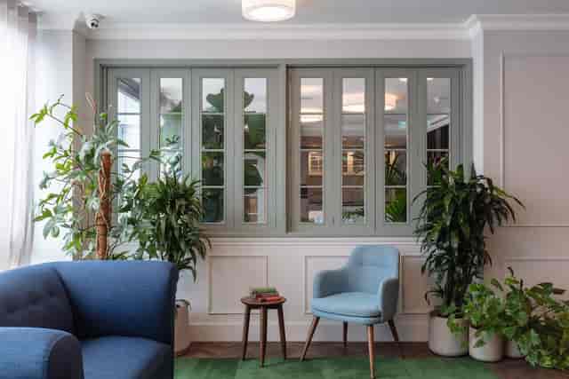 Fern venue breakout space with glass doors for corporate events and networking.