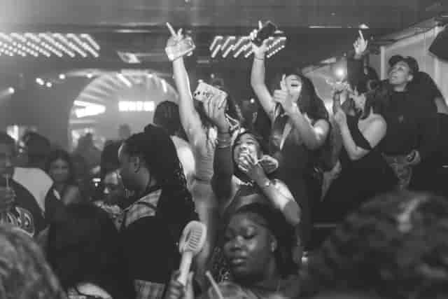 High-energy crowd at Palms Caribbean Fusion experiential event with dynamic lighting and atmosphere.