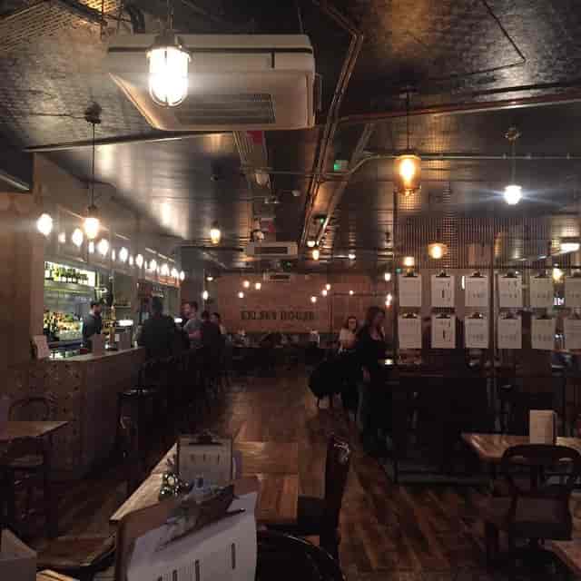 Industrial-chic Kelsey House bar with brick walls for corporate mixers and networking events.