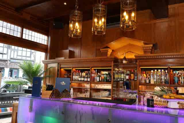 Private dining room with wood-paneled walls and LED bar for VIP cocktail receptions and events.