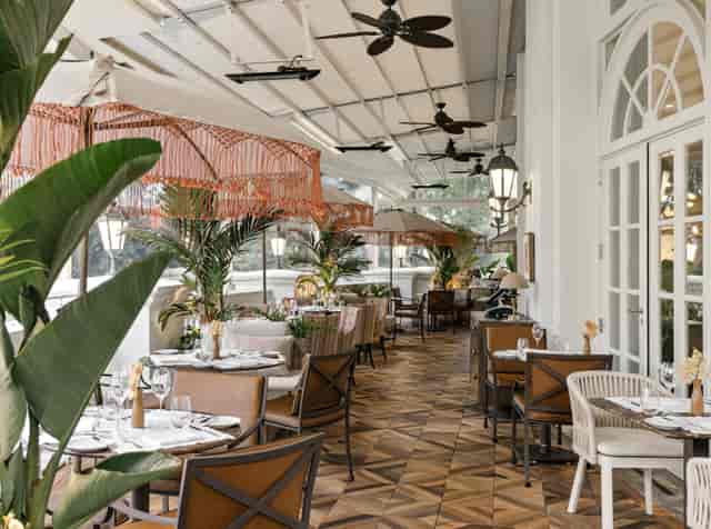 Rooftop terrace with retractable roof for corporate events and outdoor networking receptions.