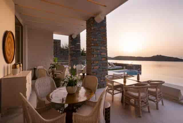 Waterfront Terrace event venue with bistro seating for executive retreats and VIP receptions.