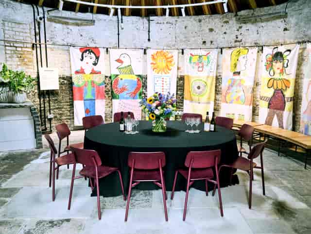 Windmill Base private dining room with exposed brick and art for corporate events and meetings.